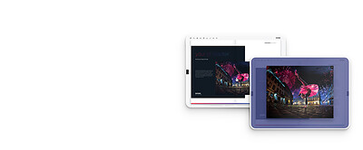 Two tablets: a Fluidbook page and the same photo enlarged by a zoom area